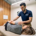Patient receiving manual therapy treatment at a sports medicine clinic in Los Angeles